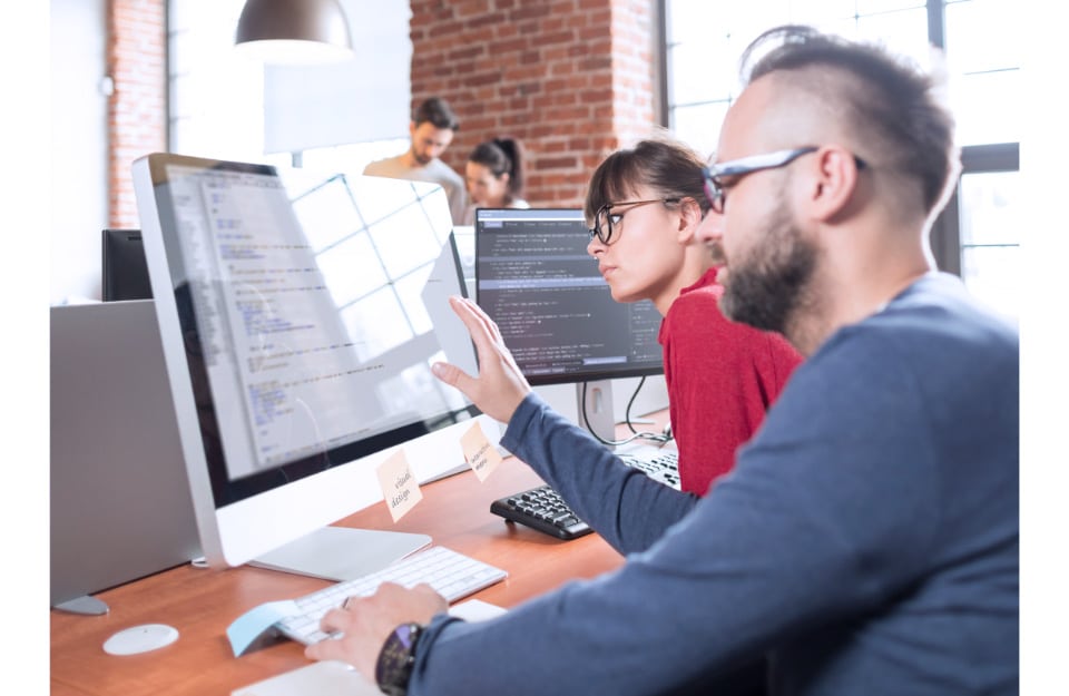 Entrepreneur Business Man and Woman Using Laptop Computer