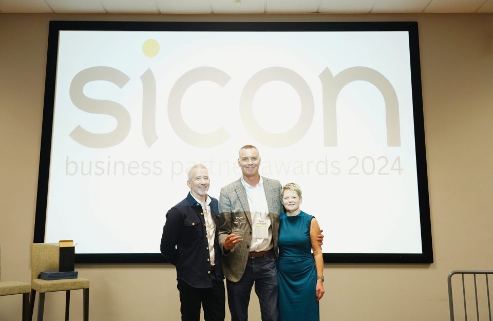 Gary McKnight from Thinc is presented with the Youngman Award by Sicon co-owners Jane and Richard Youngman