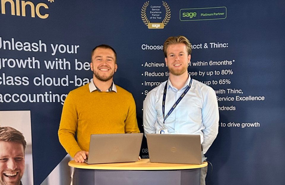 Thinc's consultants Ethan Jude and Joseph Ingle at the Thinc stand at an itSHOWCASE event.